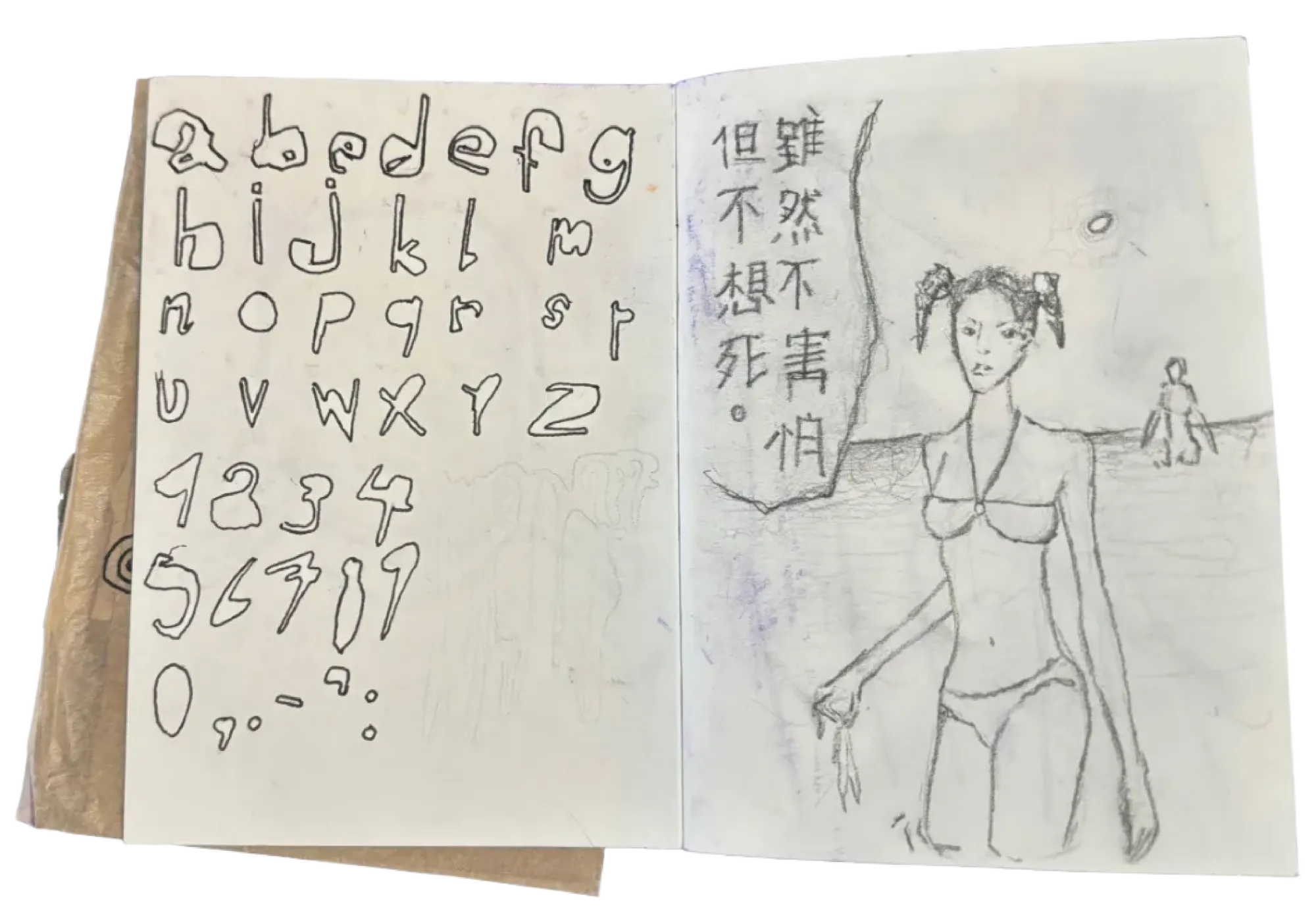 Notebook, alphabet and drawings